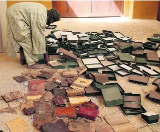  ?? Benoit Tessier / Reuters ?? Extremists swept into the country’s remote north in 2012. Among other artefacts, they either burnt or stole several ancient manuscript­s at the Ahmed Baba Institute in Timbuktu.