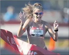  ?? CHARLIE RIEDEL — THE ASSOCIATED PRESS ?? Robyn Stevens celebrates after winning the women’s 20-kilometer race walk at the U.S. Olympic Track and Field Trials on June 26 in Springfiel­d, Ore.