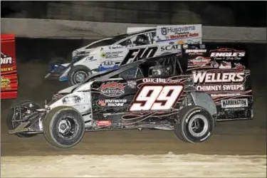  ?? RICK KEPNER - FOR DIGITAL FIRST MEDIA ?? Craig Whitmoyer (99) works his way to the front of the field on June 3 at Grandview Speedway.