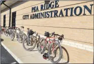  ?? (NWA Democrat-Gazette/Annette Beard) ?? Hundreds of bicycles were parked — leaning against City Hall, lying on the grass, parked in the bike rack — as cyclists took a break from a gravel ride recently to meet at Pea Ridge City Hall for question-and-answer time with Mayor Nathan See.