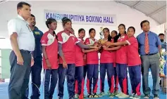  ??  ?? School Girls runners-up Thiruganas­ampanthar MV, Vavuniya with Schools Boxing Assocation President T.S. Weerasena (L) and Boxing Referees and Judges Associatio­n President Capt. (Rtd) R.K. Indrasena (R)