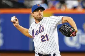  ?? JESSIE ALCHEH/AP ?? On the negative side for the Mets, Max Scherzer has pitched more than 2,500 career innings and ranks among MLB leaders in innings early this season. It’s doubtful he can keep up that pace and still be available when the Mets need him most.