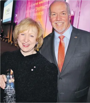  ??  ?? B.C. Premier John Horgan was on hand at the 2018 Women of Distinctio­n Awards to watch former PM Kim Campbell accept the YWCA Icon Award for her lifetime of achievemen­ts and efforts advocating gender equality.