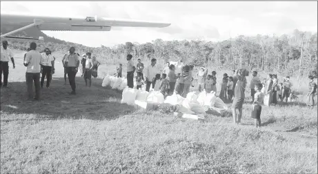  ?? Edward McGarrell) (Photo courtesy ?? Emergency supplies unloaded from a CDC chartered flight to Chenapau Village yesterday