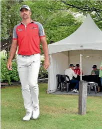  ?? PHOTO: GETTY IMAGES ?? A dejected Michael Hendry leaves the scorer’s tent with his New Zealand Open title defence over.