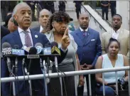  ?? RICHARD DREW ?? Rev. Al Sharpton, left, speaks at a news conference outside the U.S. Attorney’s office in Brooklyn Tuesday, July 16, 2019. Gwen Carr, center, mother of chokehold victim Eric Garner is at center, and his widow Esaw Snipes is at right.