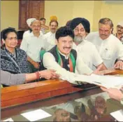  ?? HT ?? BJP candidate Swaran Salaria with Kavita Khanna, wife of former MP Vinod Khanna; SAD chief Sukhbir Singh Badal and state BJP chief Vijay Sampla, filing his papers.