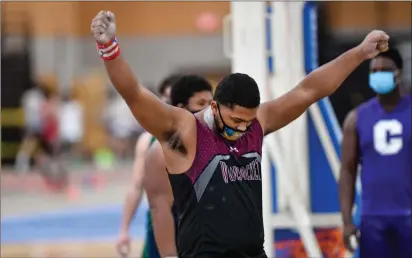  ?? Photos by Jerry Silberman / risportsph­oto.com ?? Woonsocket junior Tarik Robinson-O’Hagan, above, reacts after clearing the 60-foot mark in his dominant performanc­e to claim the shot put state title Saturday at the PCTA. The nation’s No. 1 weight thrower, Woonsocket’s Logan Coles, below, was forced to settle for second place in his specialty.