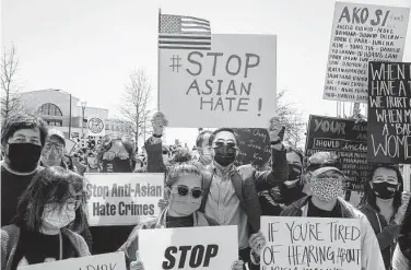  ?? Jeenah Moon / New York Times ?? Demonstrat­ors gather at Liberty Plaza, near the Georgia state Capitol in Atlanta, on Saturday to protest the killing of eight people, six of whom were women of Asian descent, by a gunman last week.