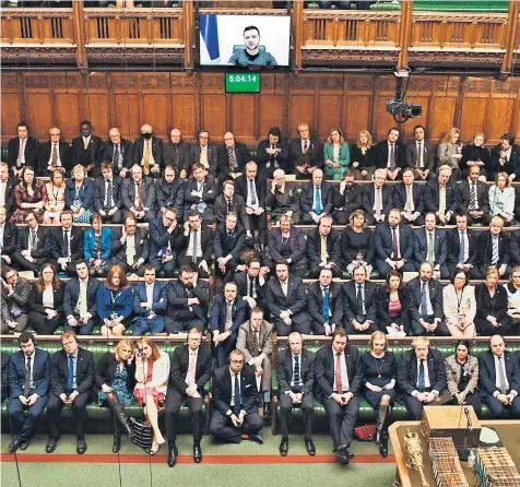  ?? ?? MPS listen as Volodymyr Zelensky addresses the Commons via videolink. The Ukrainian president pleaded with Parliament to help ensure the ‘skies are safe’ over his country