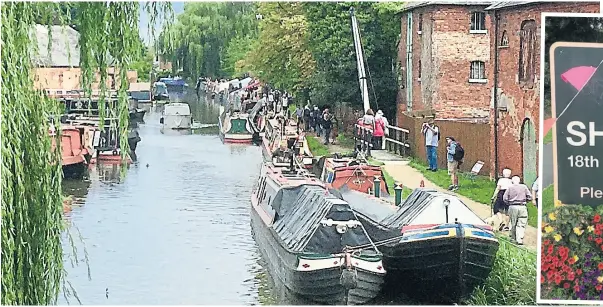  ?? ?? Working boats moored abreast outside two warehouses, one built in 1780 and one in 1820, which once had their own basin, now filled in.