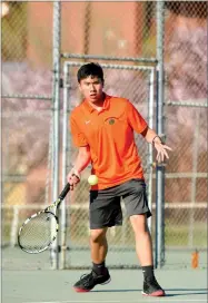  ?? RECORDER PHOTO BY NAYIRAH DOSU ?? Portervill­e High School’s Adrian Remigio watches the ball during a No. 2 singles match against Delano High School at Portervill­e High School.