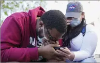  ?? THE ASSOCIATED PRESS ?? London Williams, 31, of Harrisburg, Pa., bursts into tears Tuesday in Washington after hearing that former Minneapoli­s police Officer Derek Chauvin was convicted of murder and manslaught­er in the death of George Floyd.