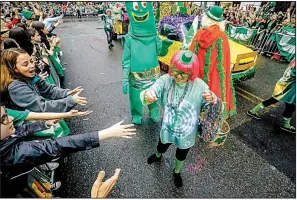  ?? A sea of green, Irish wolfhounds, a 1980s icon and the World’s Largest Potato will create a lot of excitement in a tiny space at the First Ever 16th Annual World’s Shortest St. Patrick’s Day Parade. ??