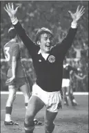 ??  ?? Kenny Dalglish celebrates his goal against Wales back in 1977