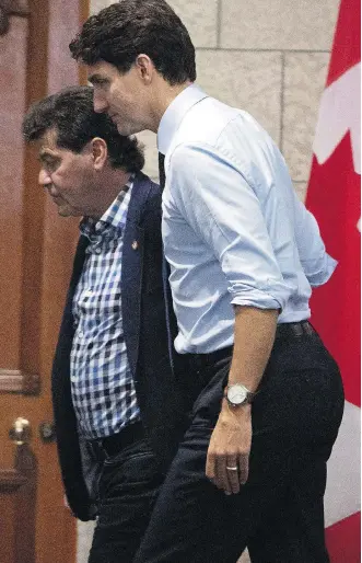  ?? FRED CHARTRAND/THE CANADIAN PRESS ?? Unifor president Jerry Dias, left, and Prime Minister Justin Trudeau meet Tuesday in Ottawa in the wake of GM’s decision to shutter plants in Oshawa, Ont., and the U.S.