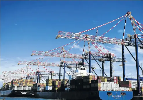  ?? Picture: Gallo Images/Khaya Ngwenya ?? Ships being loaded at the Port of Ngqura near Port Elizabeth. A strike by stevedores is threatenin­g the country’s citrus industry.