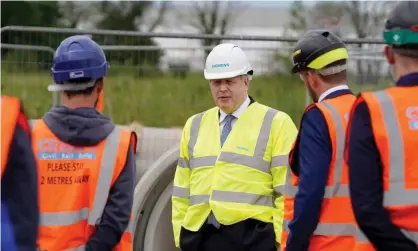  ?? Photograph: Andrew Parsons/No 10 Downing Street handout/EPA ?? Boris Johnson on a visit this week to the Siemens rail factory constructi­on site in Goole, East Yorkshire.