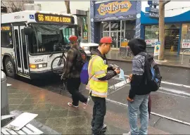  ?? PHOTO COURTESY VTA STAFF ?? A member of the VTA outreach staff is seen at the Santa Clara Station in downtown San Jose distributi­ng informatio­n regarding the new VTA fare structure and transfer policy that begins today.