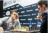  ??  ?? Caruana (r.) gibt Weltmeiste­r Carlsen Rätsel auf. Foto: Imago