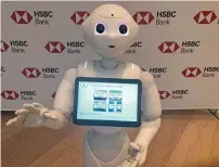  ?? Reuters ?? Pepper the robot has apparently helped HSBC open 20 per cent more accounts in July. —