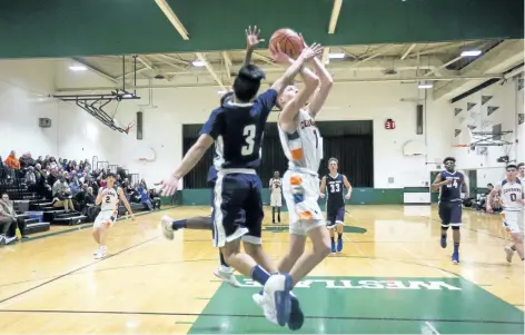  ?? BOB TYMCZYSZYN/ STANDARD STAFF ?? Kennan Larmand from the Welland Centennial Cougars goes to the hoop against the St. Paul Patriots in the Review boys basketball tournament final Friday at Westlane Secondary School.