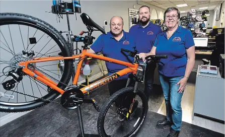  ?? MATHEW MCCARTHY WATERLOO REGION RECORD ?? Doug, left, Corey, and Joan Cota are the owners of Waterloo Bike Shop. The store on Toll Gate Boulevard is a sister shop to Listowel Bike Shop.