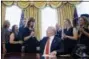  ?? CAROLYN KASTER - THE AP ?? President Donald Trump shakes hands with pilot Tammie Jo Shults, as he meets with crew and passengers of Southwest Airlines Flight 1380 in the Oval Office of the White House in Washington, Tuesday, May 1, 2018.