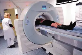  ??  ?? LILLE: Photo shows a patient undergoing a scan, at the Oscar Lambret Center in Lille, northern France, a regional medical unit specialize­d in cancer’s treatment. Cancer will kill 5.5 million women—almost the population of Denmark—every year by 2030, a...