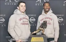  ?? Richard Drew/Associated Press ?? Oklahoma’s Baker Mayfield, left, and Dede Westbrook are both Heisman Trophy finalists.