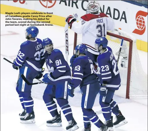  ?? — VERONICA HENRI ?? Maple Leafs players celebrate in front of Canadiens goalie Carey Price after John Tavares, making his debut for the team, scored during the second period last night at Scotiabank Arena.