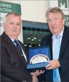  ??  ?? Denis Granville of Fermoy Credit Union presenting Brendan Keane with the Special Merit Ward.