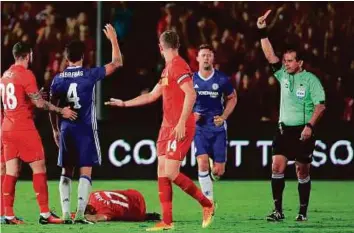  ?? AFP ?? Cesc Fabregas (4) of Chelsea receives a red card from the referee after a bad challenge on Ragnar Klavan (17) of Liverpool in the 2016 Internatio­nal Champions Cup at the Rose Bowl.