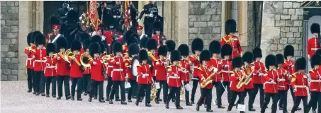  ??  ?? Tribute: Band of the Grenadier guards leaves Windsor Castle after a walk-through last Saturday