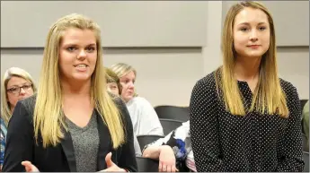  ?? TIMES photograph by Annette Beard ?? Pea Ridge High School juniors Nicole Turner and Shelby Dunlap gave their first-place merchandis­ing presentati­on to the Pea Ridge School Board Monday night. Turner and Dunlap won first place at the State Career Developmen­t Conference and will represent...