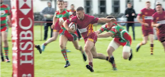  ?? Pictures: Richard Birch ?? Iolo Hughes breaks through for a Caernarfon try during last weekend’s clash with Pwllheli