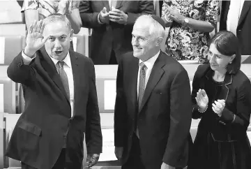  ?? — Reuters photo ?? Netanyahu (left) and Turnbull attend the Central Synagogue in Sydney, Australia.