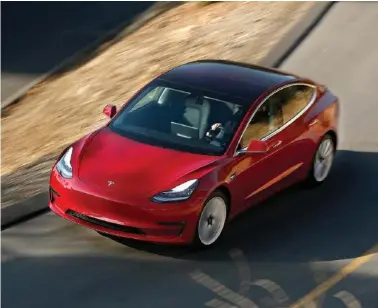  ?? (Mel Melcon/Los Angeles Times) ?? Tesla’s new Model 3 is taken for a test drive in Elysian Park on Jan. 12, 2018.