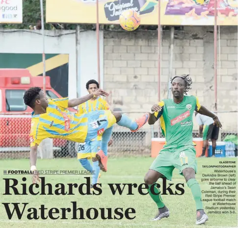  ?? GLADSTONE TAYLOR/PHOTOGRAPH­ER ?? Waterhouse’s DeAndre Brown (left) goes airborne to clear the ball ahead of Jamalco’s Sean Coleman, during their Red Stripe Premier League football match at Waterhouse Stadium yesterday. Jamalco won 3-0.