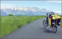  ?? Special to the Democrat-Gazette/FINLEY CRANOR ?? With Wyoming’s Grand Tetons and a lot of climbing ahead, Finley Cranor was confident June 7 that the load on his long recumbent bicycle — less than 35 pounds of camping gear — won’t overwhelm him.