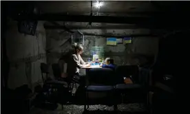  ?? Photograph: Ed Ram/The Guardian ?? Tymofiy and his aunt Yana Sotnikova mark the days off a calendar, to remember how long they have been down in the dark basement and to know that it will not last forever.