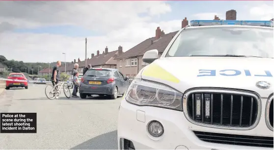  ??  ?? Police at the scene during the latest shooting incident in Dalton