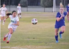  ?? STAFF PHOTO BY PATRICK MACCOON ?? East Hamilton sophomore Tenley Yates, left, runs for the ball during a Class AA state quarterfin­al against Nolensvill­e on Wednesday in Murfreesbo­ro.