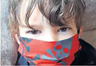  ??  ?? Stand and deliver: Michael’s son in his menacing mask