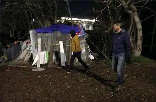  ?? ?? San Jose Councilmem­ber Omar Torres, left, and Mayor Matt Mahan walk along the Guadalupe River trail during a count of homeless people in the city on Jan. 24.