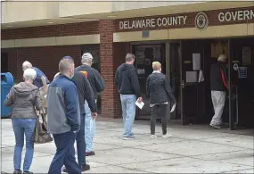  ?? PETE BANNAN — MEDIANEWS GROUP ?? Delaware County voters with ballots in hand line up to drop their ballots off at the Delaware County Government Center behind the courthouse.