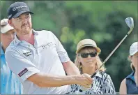  ?? AP PHOTO ?? Jimmy Walker watches his chip shot to the third green during the first round of the PGA Championsh­ip golf tournament at Baltusrol Golf Club in Springfiel­d, N.J., Thursday.