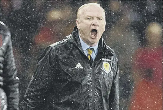  ??  ?? 2 Alex Mcleish barks out instructio­ns on a rainsoaked night at Hampden which ended with a morale-boosting win over Albania. The Scotland manager is determined to win back disaffecte­d fans by making the national side attractive to watch.