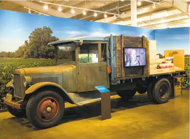  ?? PHOTOS BY LAURA MORTON / SPECIAL TO THE CHRONICLE ?? Left: Cherry packing boxes are on display in an exhibit at the San Joaquin County Historical Museum about the region’s agricultur­al innovation­s. Right: A Graham truck from 1927 is on display at the museum, which features exhibits about the heritage of...