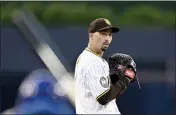  ?? Y DENIS POROY — GETTY IMAGES ?? Blake Snell #4of the San Diego Padres prepares to pitch during the first inning against the New York Mets at Petco Park on July 8, 2023 in San Diego.